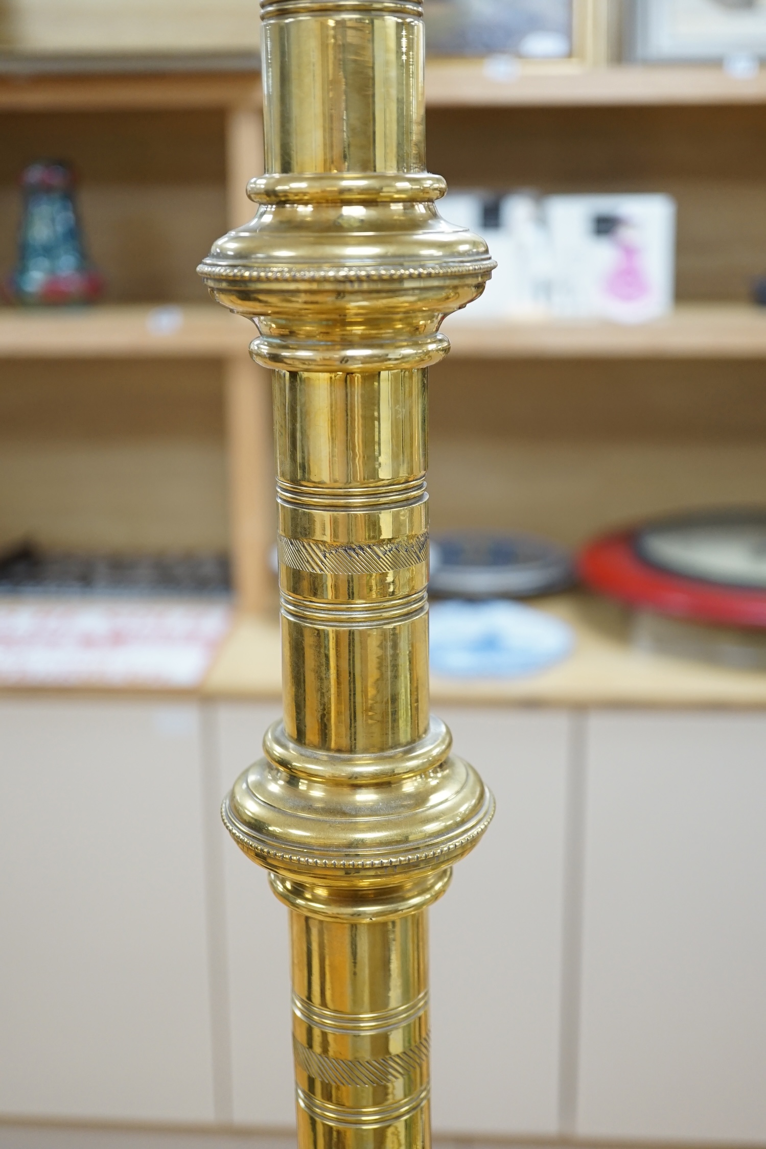 A pair of 19th century tall decorative brass ecclesiastical candlesticks, 90cm high. Condition - fair to good